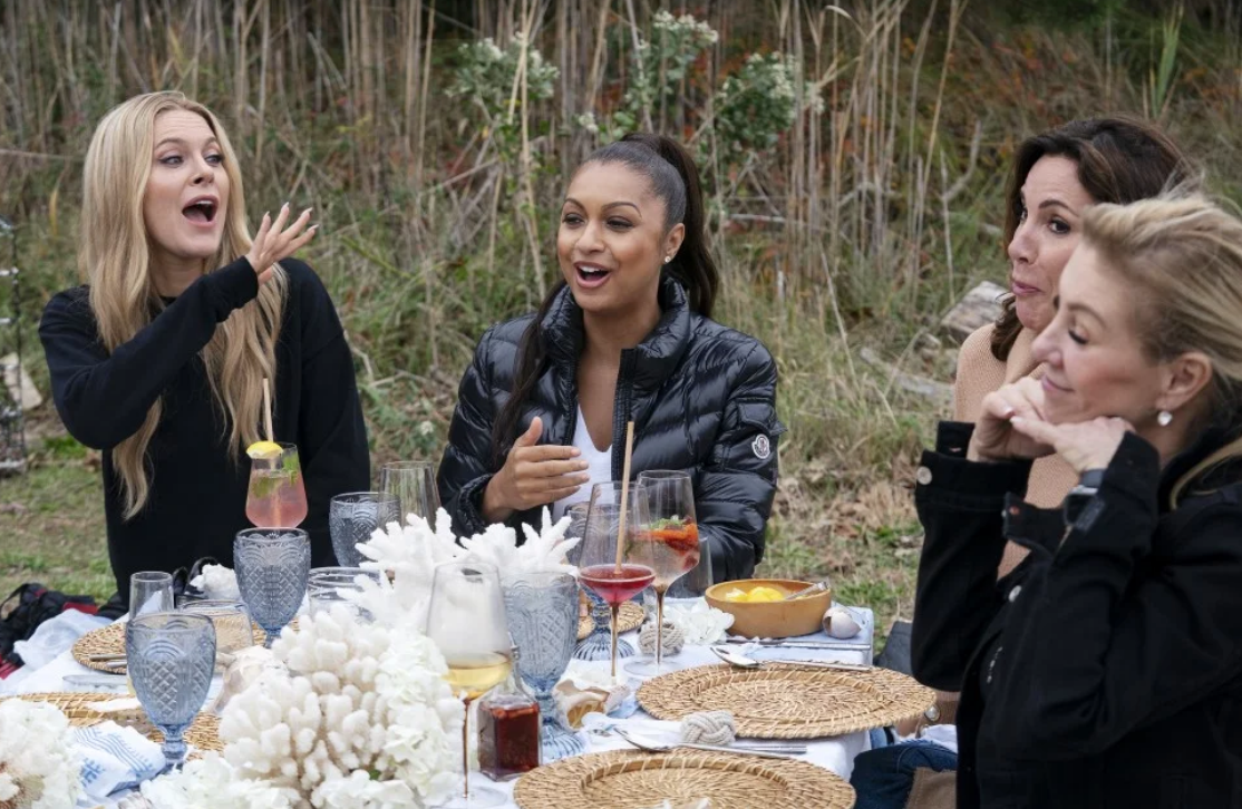 The ladies having a good time at their outdoor lunch. 