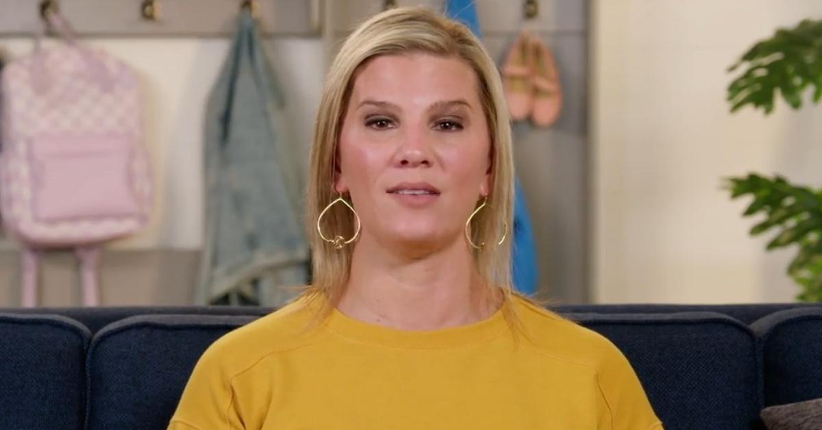 Aunt KiKi wears dangly earrings and a yellow sweater for an 'OutDaughtered' confessional.