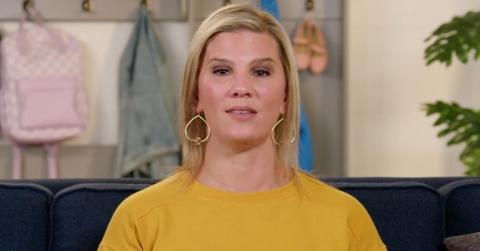 Aunt KiKi wears dangly earrings and a yellow sweater for an 'OutDaughtered' confessional.