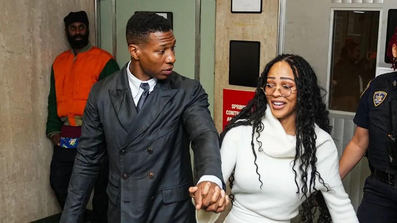 Jonathan Majors and Meagan Good leave the courthouse on Dec. 15, 2023
