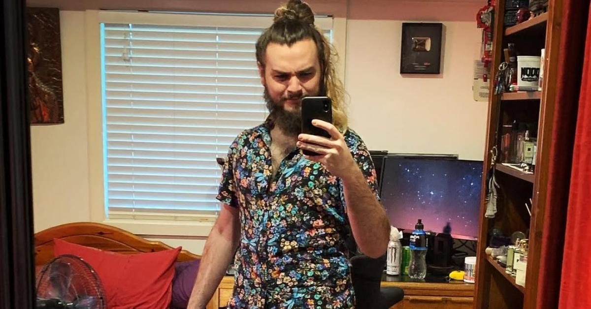 Camelworks takes a mirror selfie in his room.