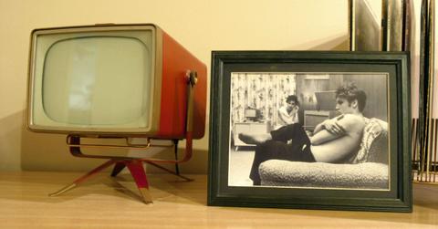 framed photo of Elvis next to a vintage TV