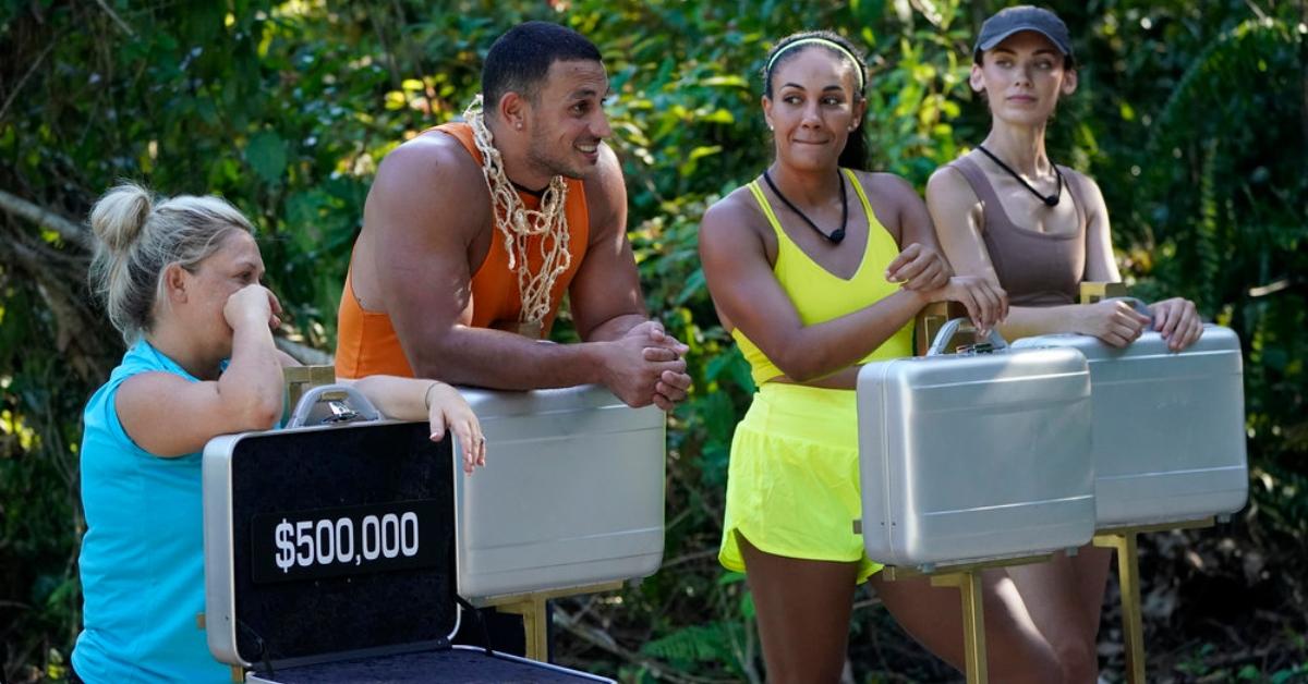 Season 1 cast of 'Deal or No Deal Island' holding silver suitcases