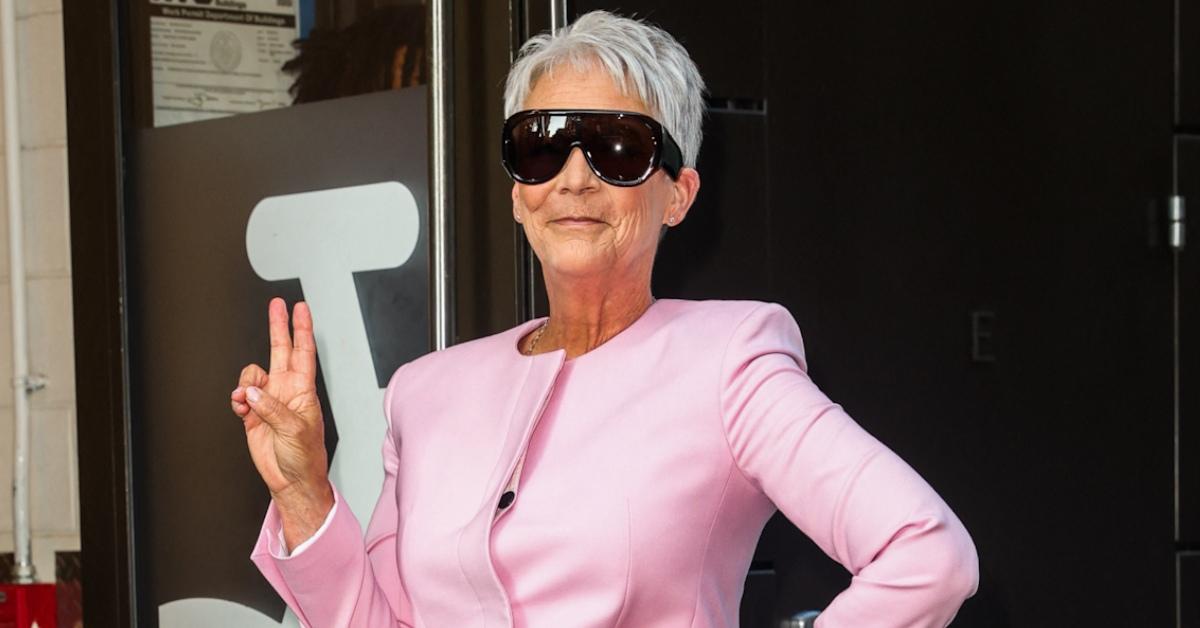 Jamie Lee Curtis in a pink pants suit.