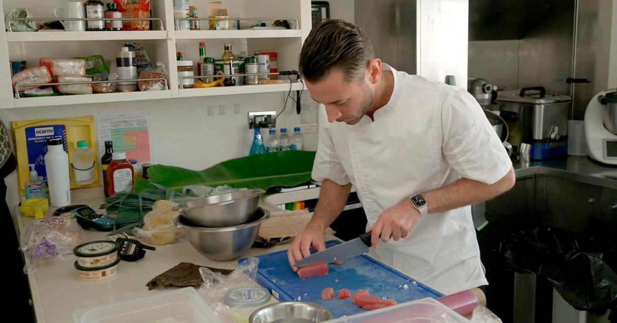 Chef Anthony Iracane chopping up a protein in Season 11 of 'Below Deck.'