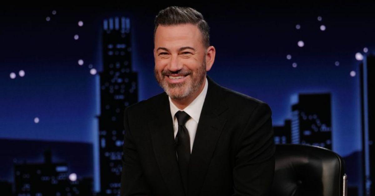 Jimmy Kimmel behind his desk on his show. 