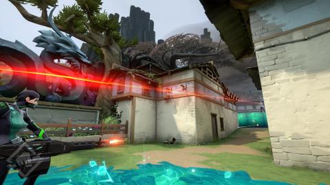 Two players shooting at each other in Valorant, with one using a sniper and the other with a minigun.