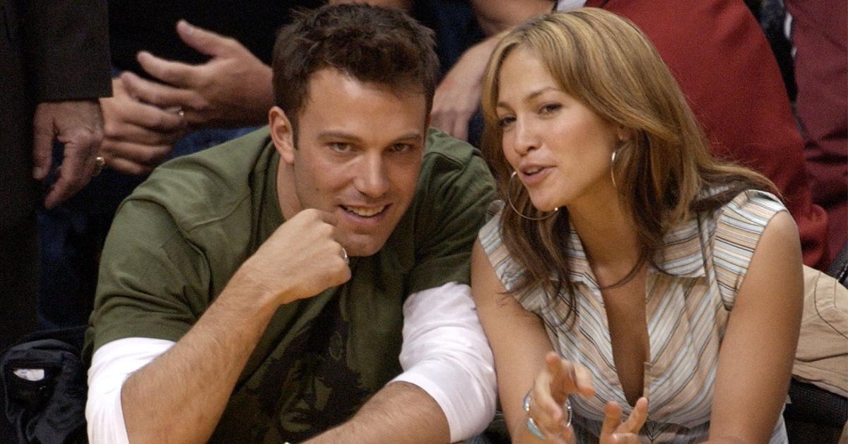 Ben Affleck and Jennifer Lopez sit court side. 