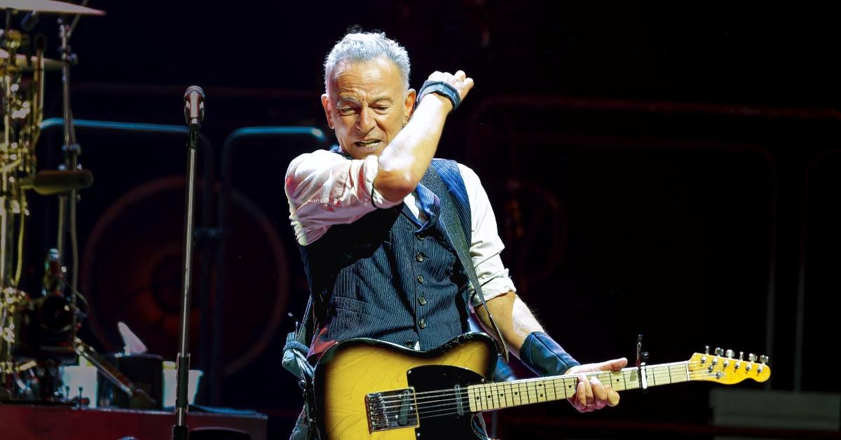 Bruce Springsteen playing at a concert.