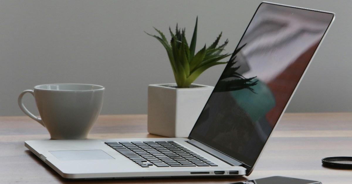 An open MacBook on the table.