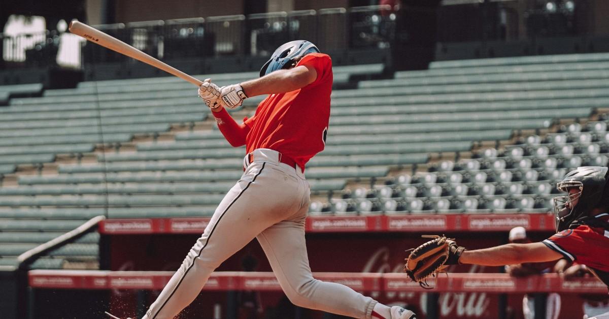 Baseball player hitting a ball