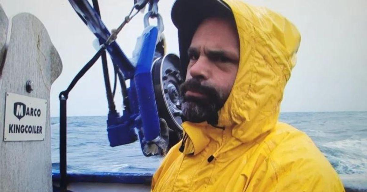 Matt Bradley looking concerned in a yellow rainjacket on 'Deadliest Catch'