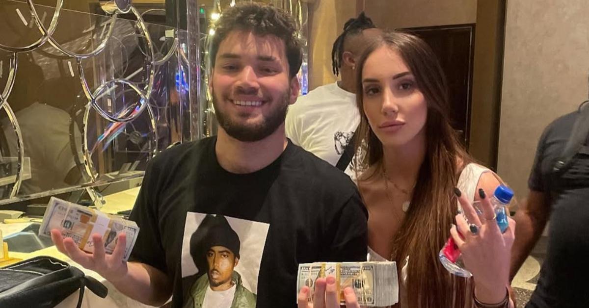 Adin and Naomi Ross holding stacks of money.