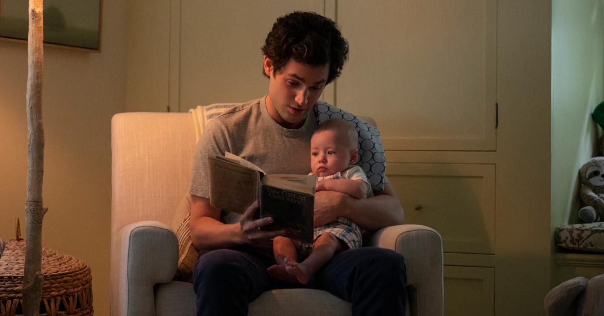 Penn Badgley as Joe Goldberg with his infant son Henry in Season 3 of 'You'