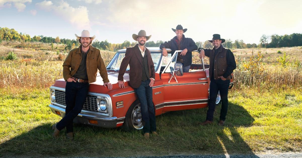 The four farmers posing in front of a red truck in Season 2 of 'Farmer Wants a Wife.'