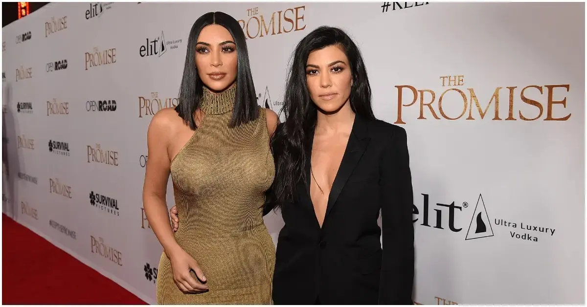 Kim and Kourtney Kardashian at a red carpet event