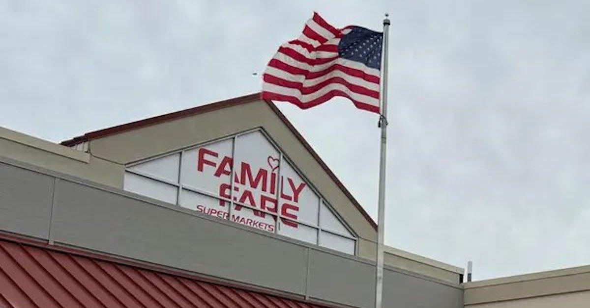 Family Fare grocery store sign with an American flag waving