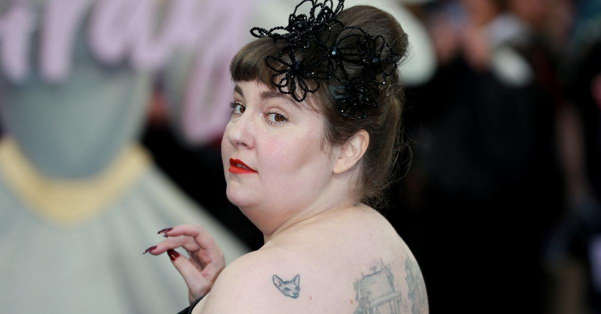 Lena Dunham wearing a black dress at a movie premiere.