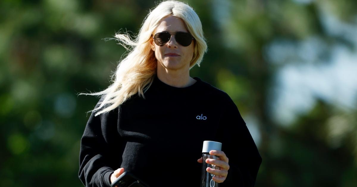 Elin Nordegren looks on as her son Charlie Woods takes part in pre-qualifying for The Cognizant Classic.