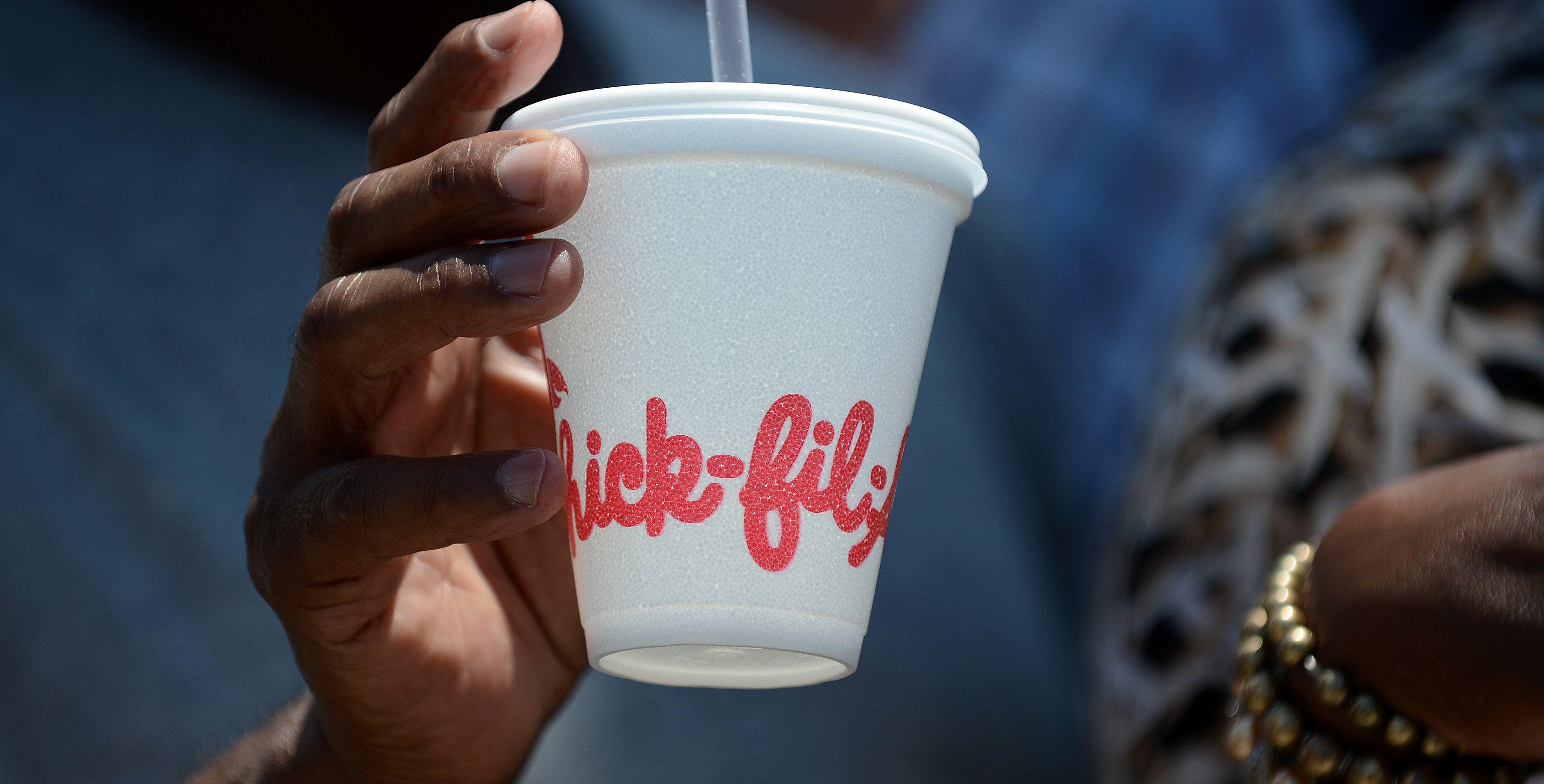 A man carries he drink outside a Chick-fil-A fast food restaurant in Hollywood, Calif. on Aug. 1, 2012.