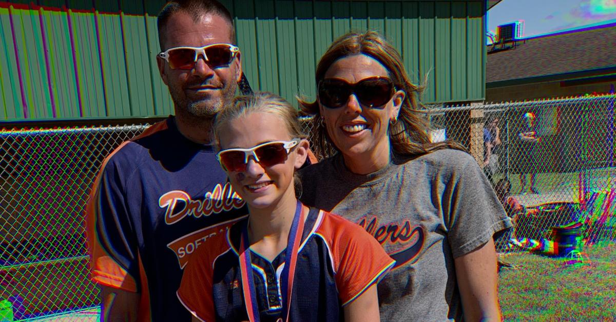 Lauryn Licari with her family at a softball game.