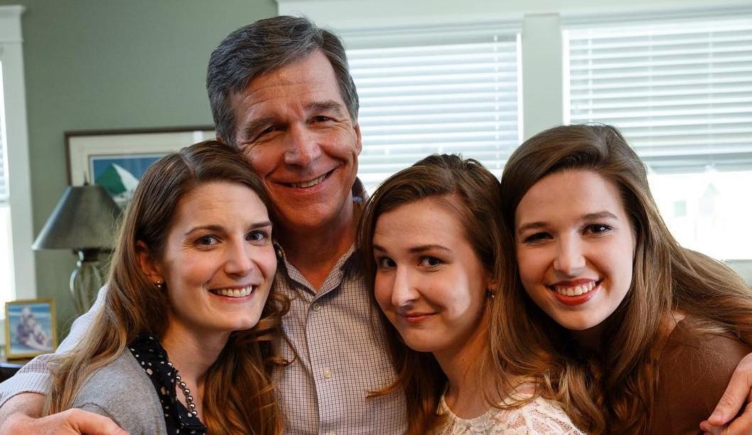 Roy Cooper with his three daughters, Natalie, Claire, and Hilary