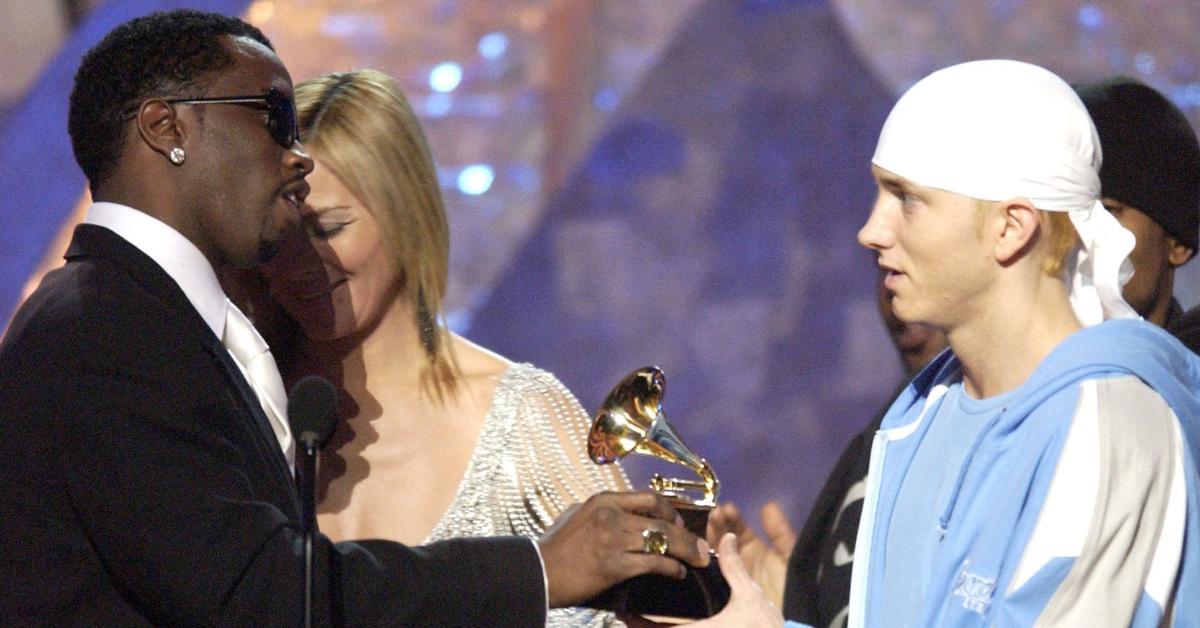 Sean "P. Diddy" Combs and Kim Cattrall present a Grammy Award to Eminem for Best Rap Album at the 45th Annual Grammy Awards.