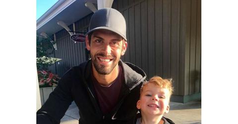 Justin Tucker with his son outside.