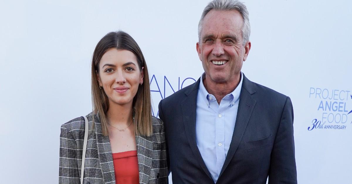 (L-R) Kyra Kennedy in a grey blazer and red blouse, stands next to her father, Robert F. Kennedy Jr., in a blue suit 