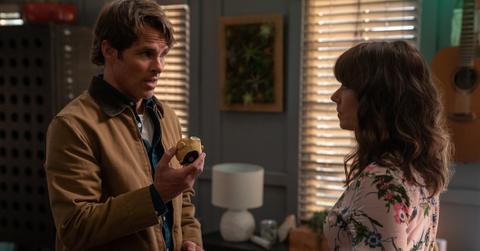 Judy and Ben with bird figurine in "Dead to Me'