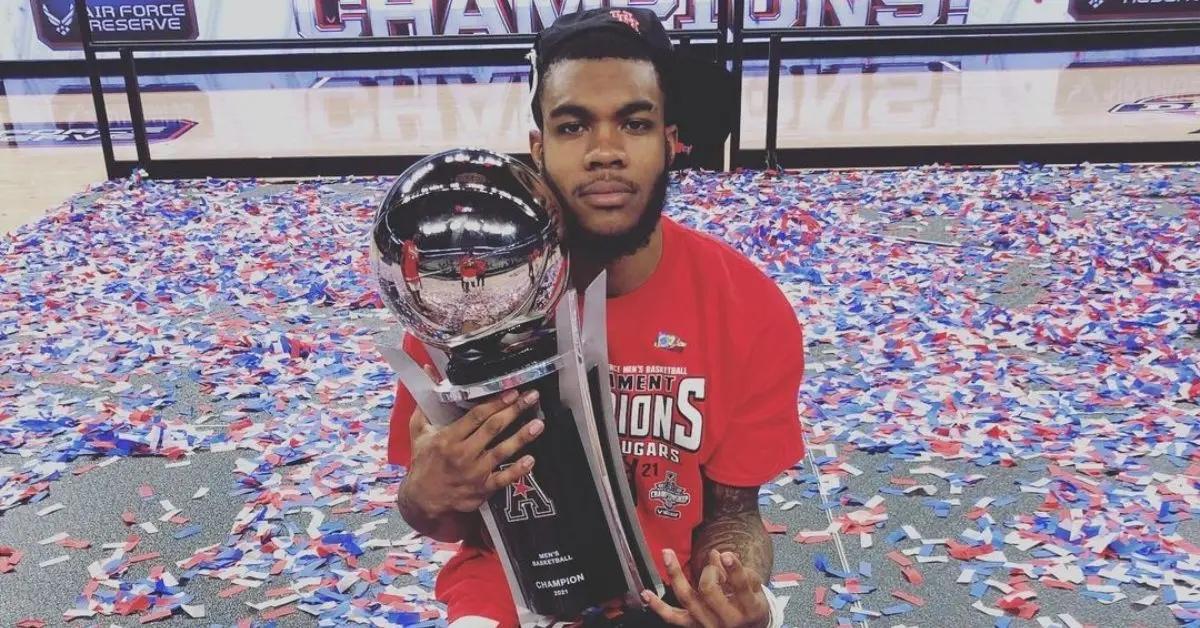 Reggie Chaney holding a trophy.