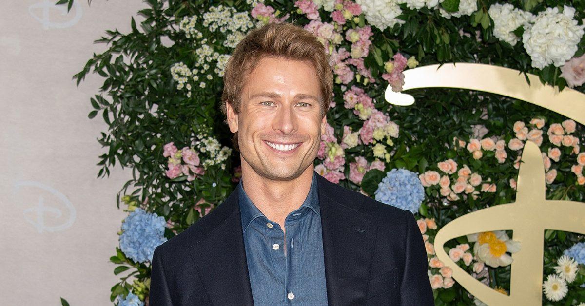 Glen Powell on the red carpet for a Disney event.