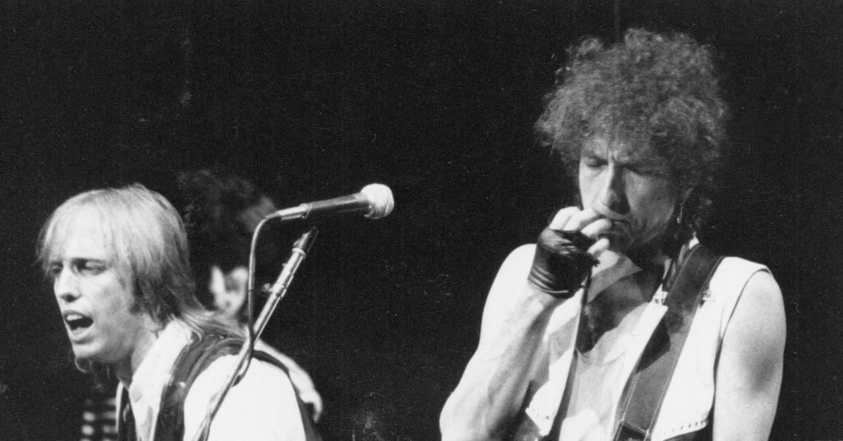 Bob Dylan and Tom Petty performing on stage together. 