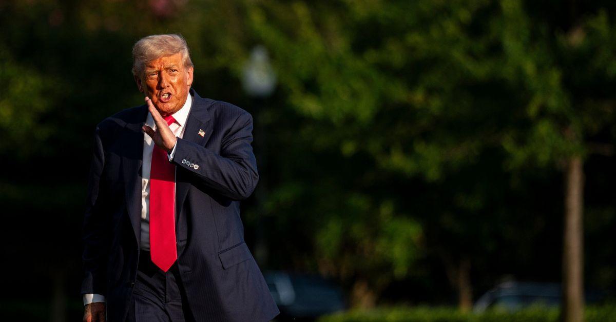 Donald Trump arriving at the White House via helicopter.