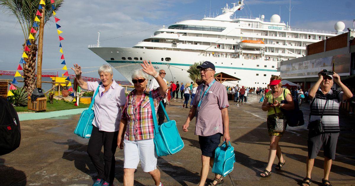 Tourists exiting a cruise ship at a Venezuelan port