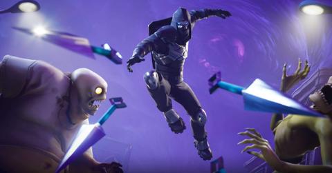 A Fortnite character attacking enemies in Save the World mode.