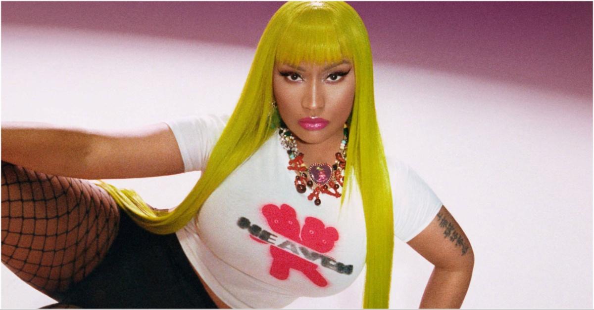 Nicki Minaj wearing a yellow wig and fish net leggings