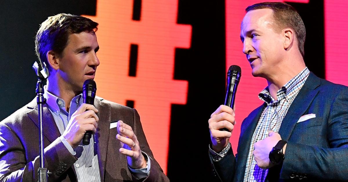 Eli Manning and Peyton Manning speak onstage during the EA Sports Bowl at Bud Light Super Bowl Music Fest 