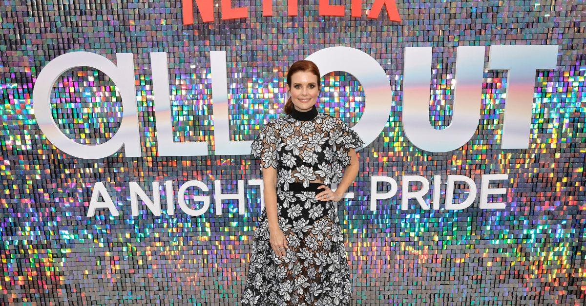 JoAnna Garcia Swisher posing at the 'The Ultimatum: Queer Love' premiere in a black and silver dress.