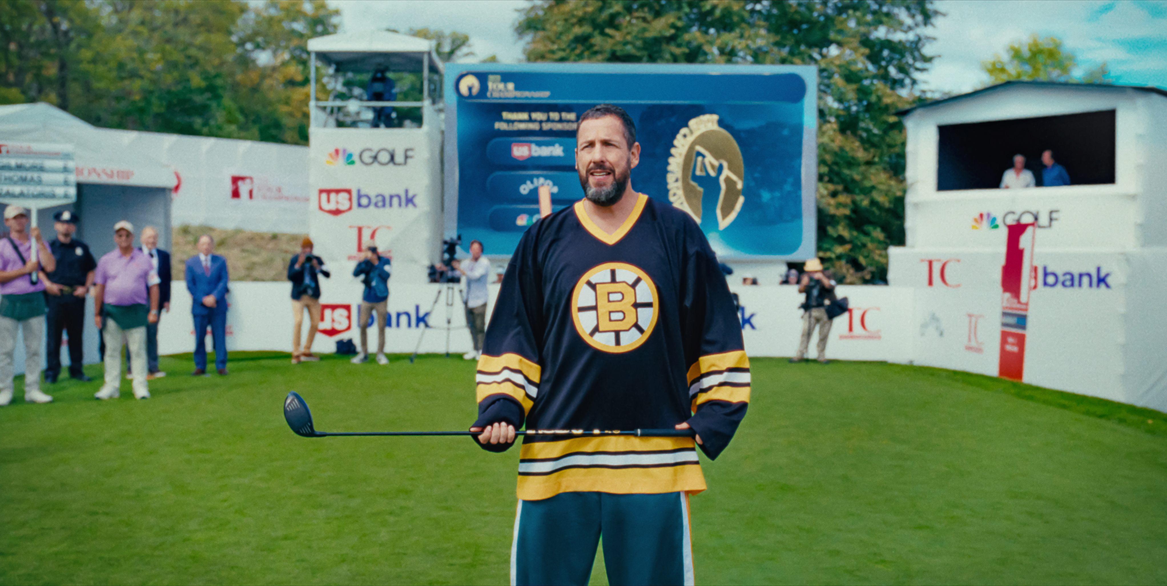 Adam Sandler holds a golf club on the green in Happy Gilmore 2