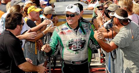 John Force shaking hands with people after a race