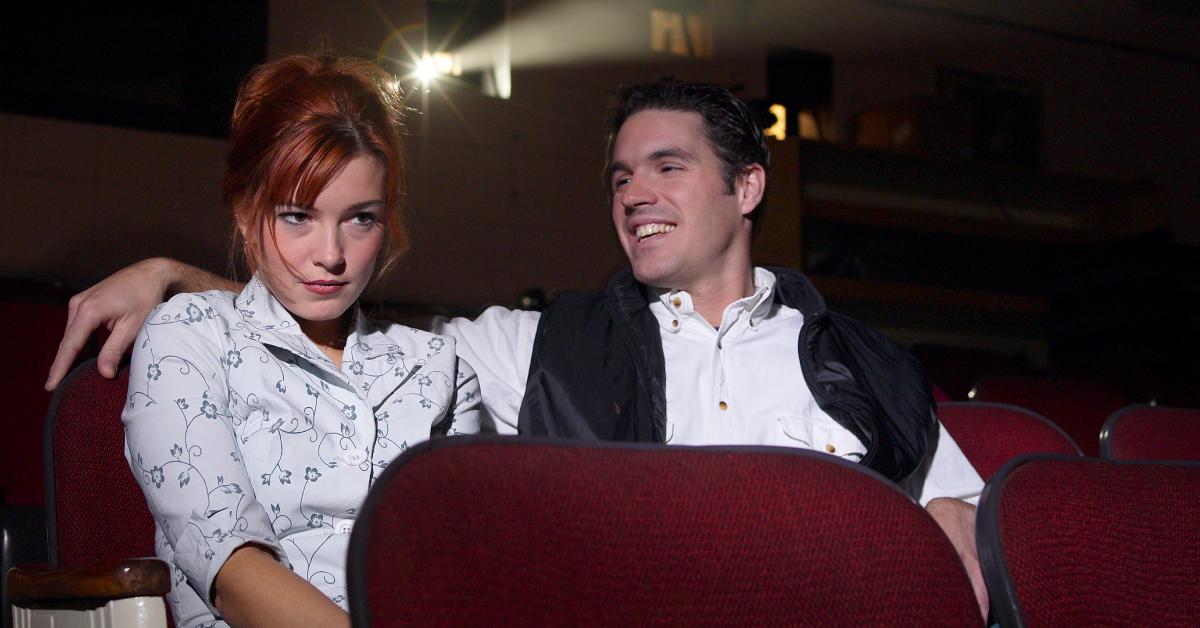This movie theater date isn't going too well for this couple.