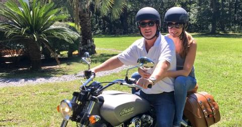J.D. Madison from 'Southern Charm' riding a motorcycle with a friend.