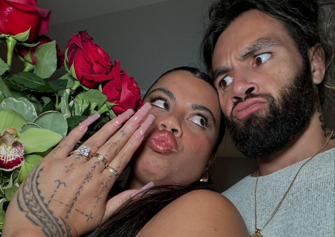 Drew Afualo and Pili Tanuvasa showing off the new engagement ring with roses