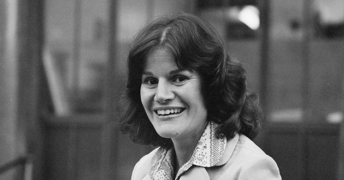 Judy Blume in 1979 in a black-and-white photo, smiling,