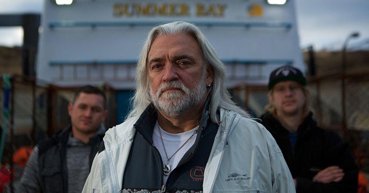 Captain Bill Wichrowski stands on the deck of the F/V Summer Bay with two crewmen behind him for his 'Deadliest Catch' promo photo