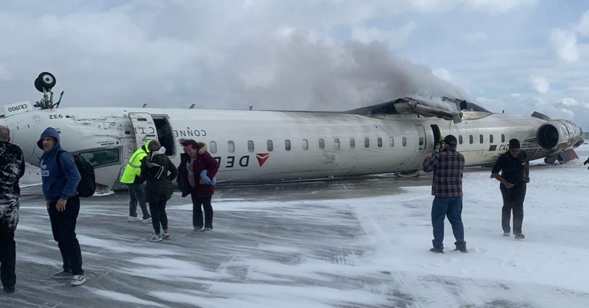 A photo of the Delta flight flipped upside down on the runway.