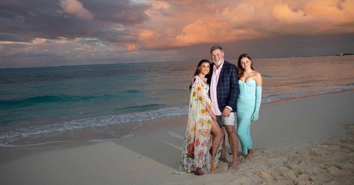 Bronwyn, Todd, and Gwen pose for a family photo on the beach