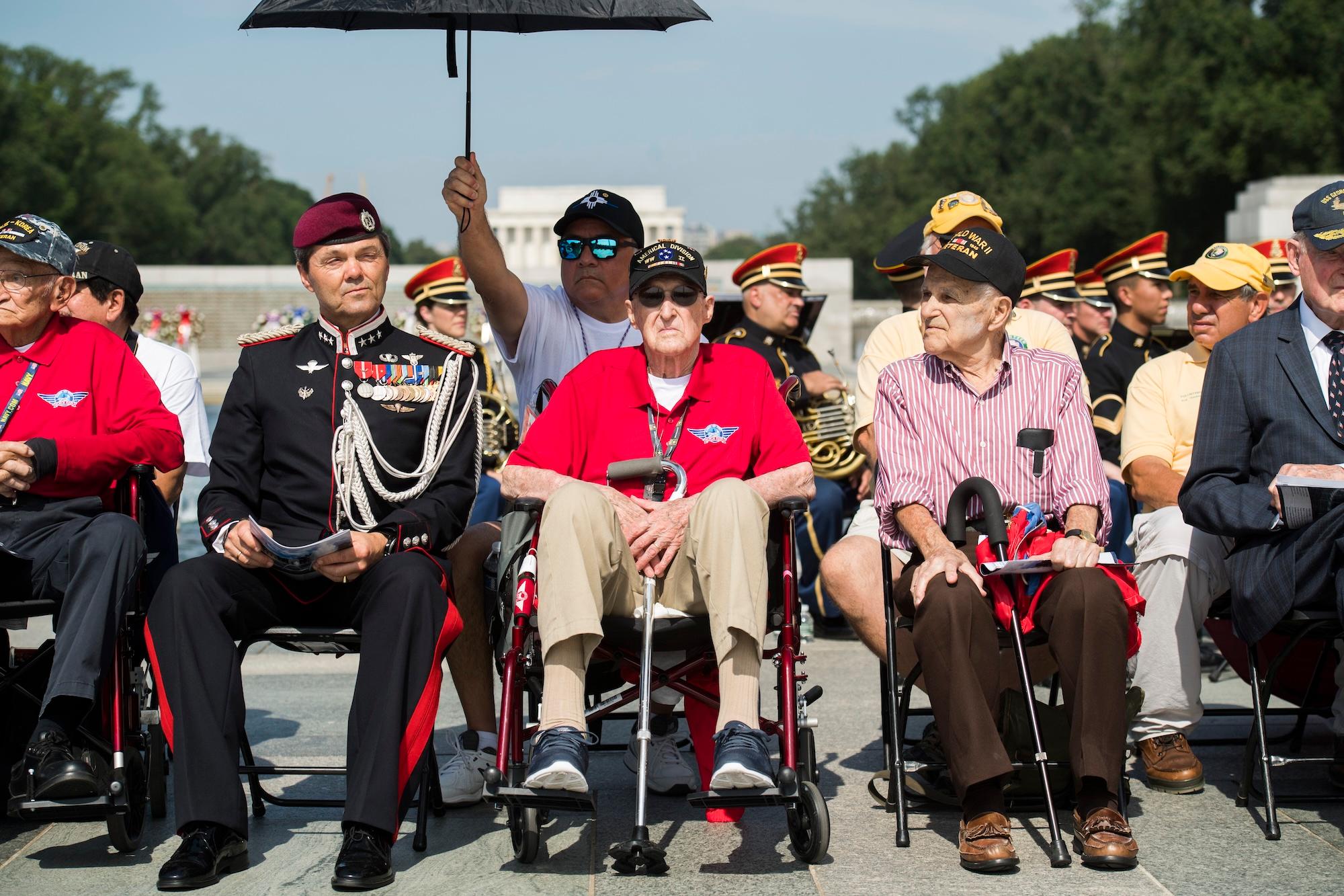 WWII veterans, some flown in from New Mexico on an Honor Flight, gathered at the National World War II Memorial in June 2019 to commemorate D-Day's 75th anniversary