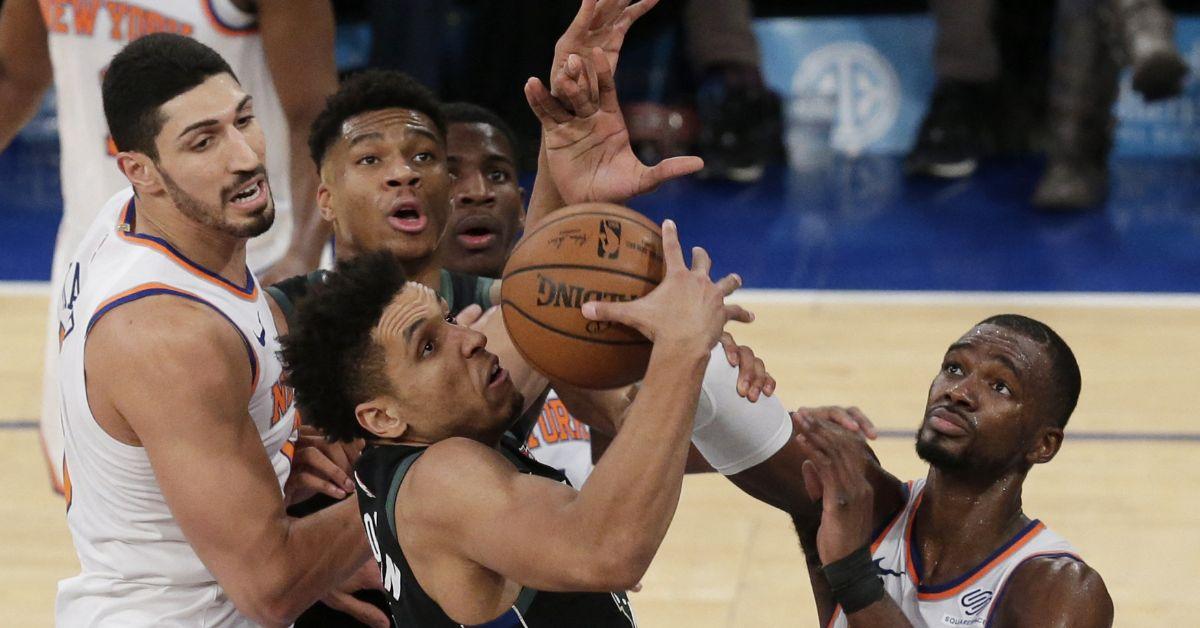 Malcolm Brogdon surrounding by Knicks during a 2018 game.